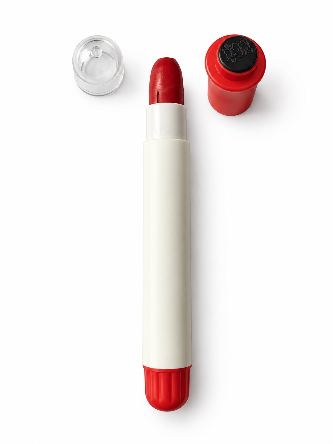 Silky crayon opened to show the crayon core and stamp
