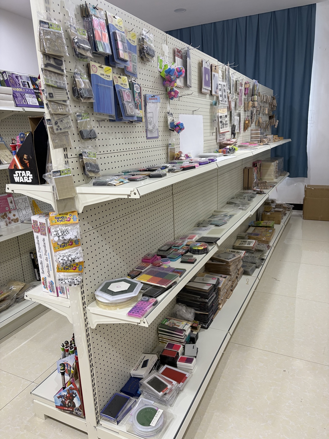 Stamp and ink pad samples displayed on shelves