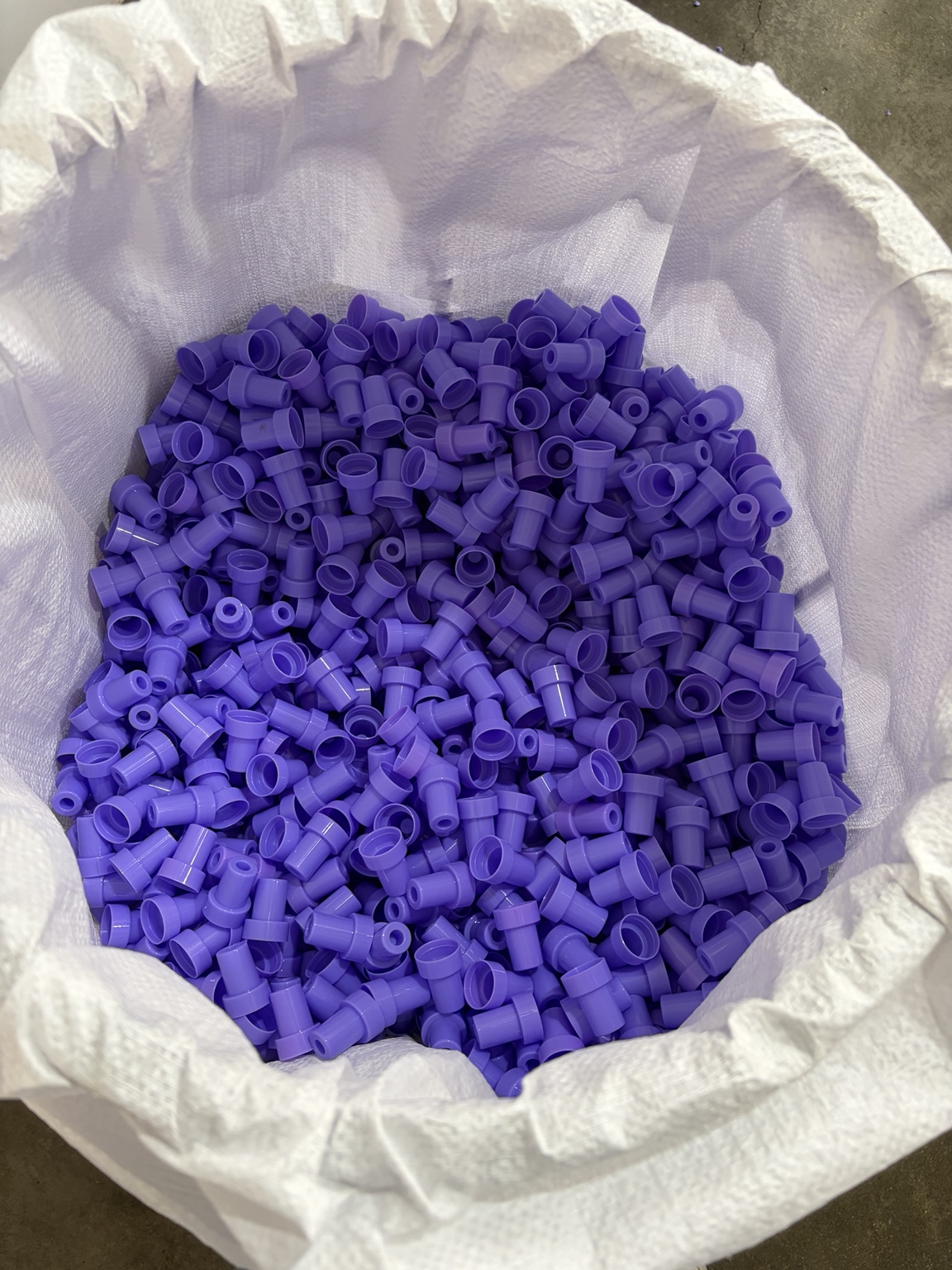 Unassembled purple plastic stamp handles